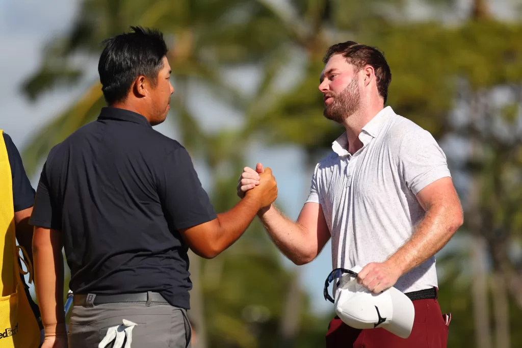 Byeong Hun An of South Korea and Grayson Murray of the United States